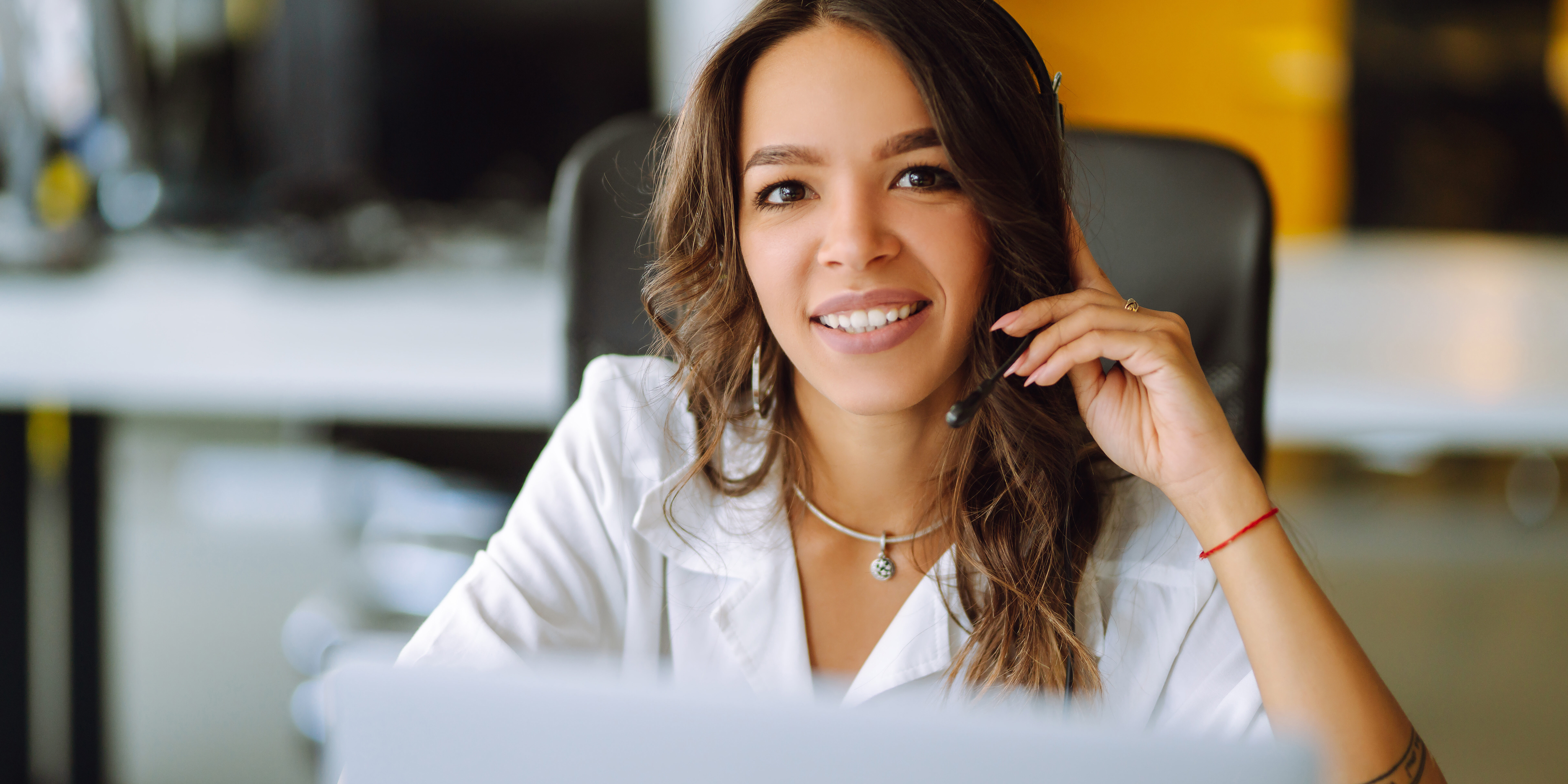 Young operator woman agent with headsets working in a call centre. Young operator woman agent with headsets working in a call centre.